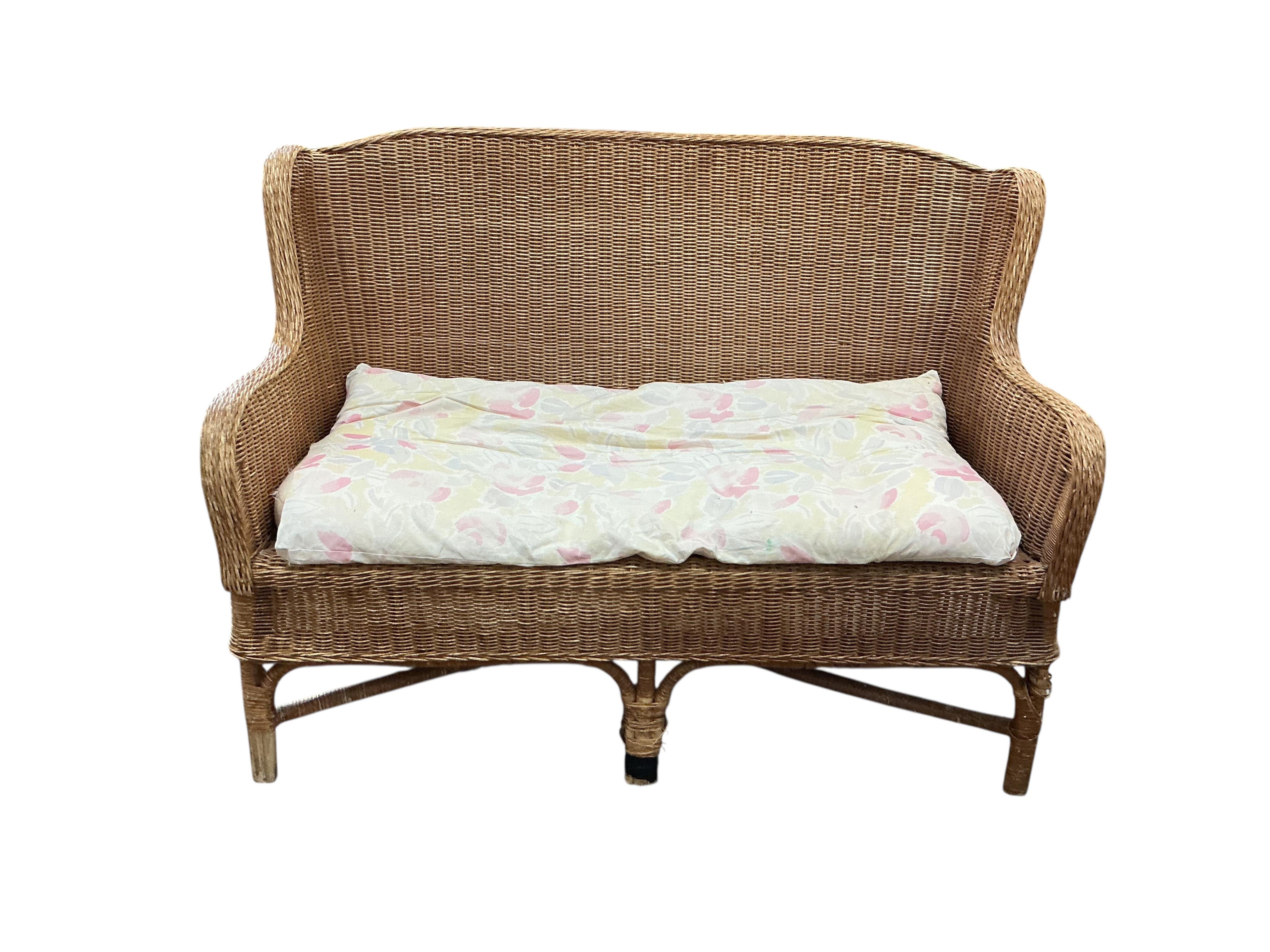 A cane conservatory settee, width 130cm, depth 66cm, height 90cm